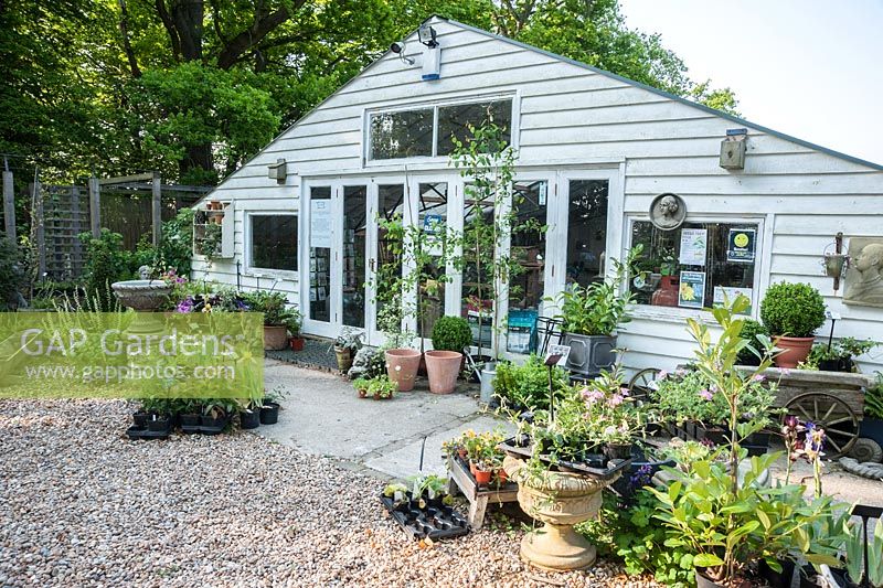 Shop surrounded by plants for sale at King John's Nursery, Etchingham, East Sussex, UK