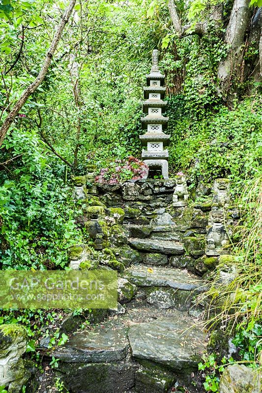 To-Doro, stupa lantern, set on a slope above the garden with Guardian lions below. The Japanese Garden and Bonsai Nursery, St.Mawgan, nr Newquay, Cornwall