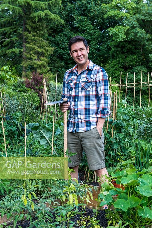 James Wong, ethnobotanist, TV presenter, author and celebrity gardener, in his own small vegetable patch where he experiments with unusual edible plants.