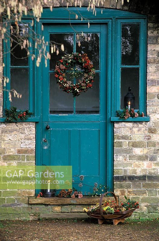 Christmas wreath on glass door to hut at Cambridge botanical gardens