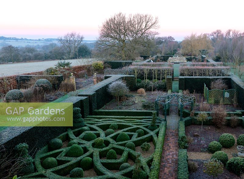 An overhead view of the formal knot garden, composed of box hedging, pyramids and balls. Garden rooms are created by yew and beech hedges.