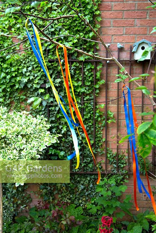 Ribbons tied to a tree branch to decorate a garden