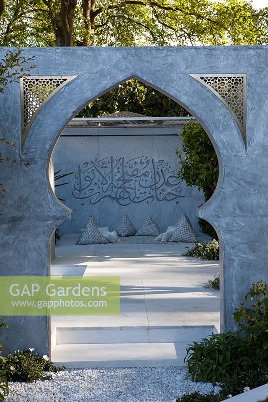 View through archway. Light and shade in hard landscaping.  The Beauty of Islam, RHS Chelsea Flower Show 2015