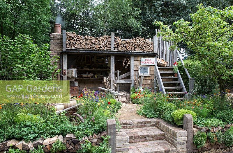 Rustic potting shed - Artisan Garden - A Trugmaker's Garden. RHS Chelsea Flower Show, 2015