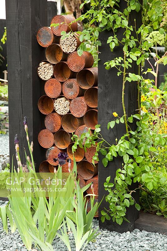 Sculpture made of recycled rusty tin cans. The Great Chelsea Garden Challenge. RHS Chelsea Flower Show 2015.