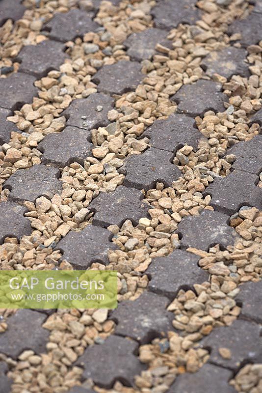 Detail of gravel and shaped stone path. Community Street BBC Gardener's Question Time Front Gardens. RHS Hampton Court Flower Show 2015