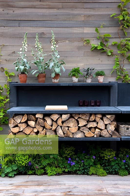 Outdoor kitchen with wood store 