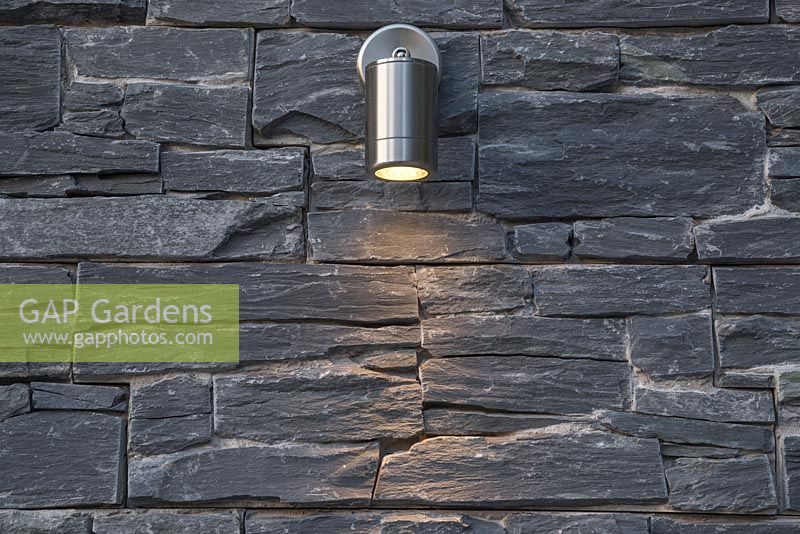 Lighting feature on a dry stone slate wall