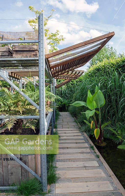 Wooden canopy. Path with wooden planks.  Le Collectionneur de L Ombre. Prize for designs and innovative idea.  Chaumont sur Loire gardenfestival 2015