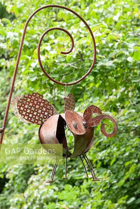 Bee sculpture made of rusted steel in Jardin des Cimes Chamoni,x France, July