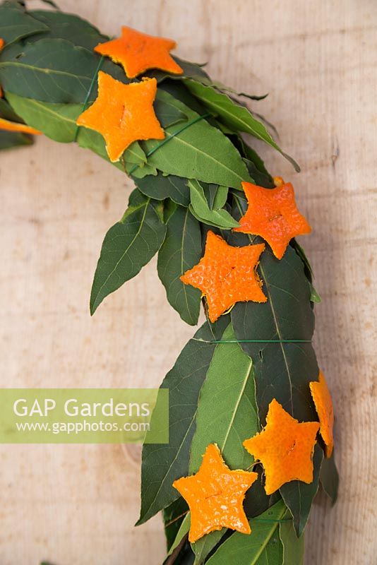 Detail of scented wreath made with Laurel leaves and small Orange stars