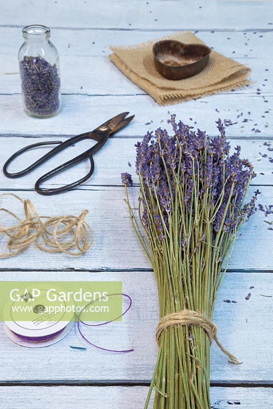 Materials required are sprigs of Lavender, needle, purple string, hessian, heart shaped object, scissors and pencil