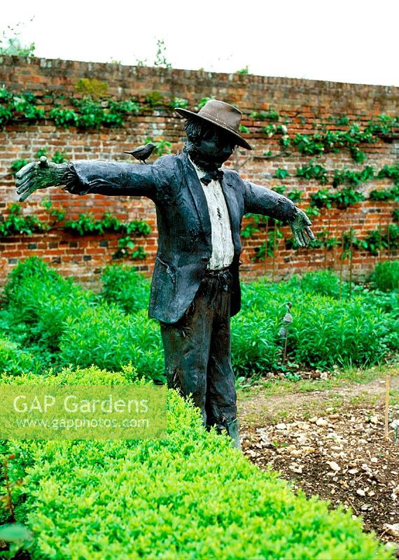 Scarecrow statue in walled vegetable garden, Godmersham Park. Owner: John Sunley