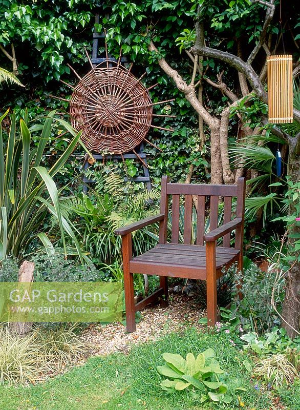 Wooden chair in gravel garden