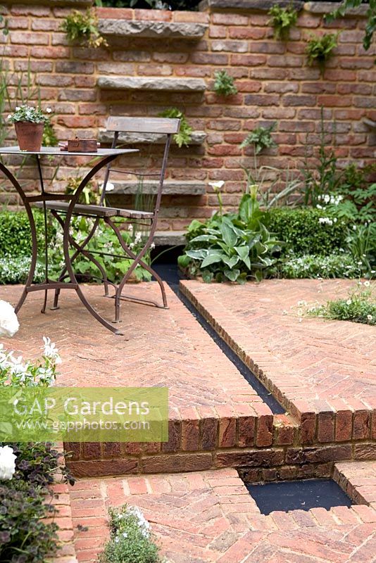 Courtyard Garden with brickwork and rill. The Jacob's Ladder Garden, Silver Flora Medal winner, Chelsea 2009. Design: Jeffery Hewitt

