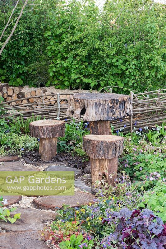 Table and stools made from tree trunks - The Woodcutter's Garden, RHS Malvern Spring Festival 2016