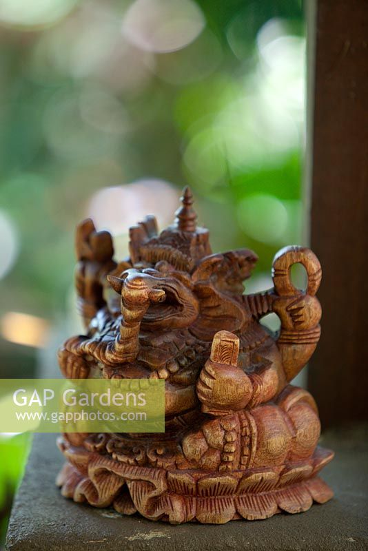 Close up of a Balinese carved timber decoration of the Elephant headed God, Ganesha.