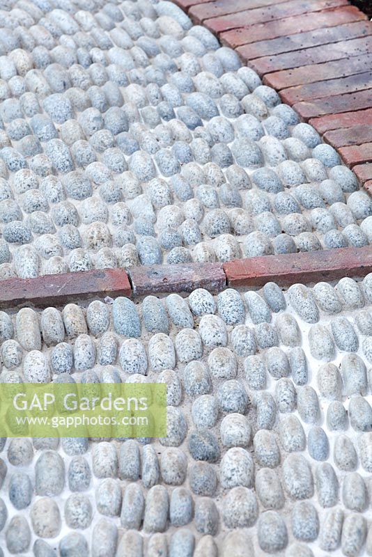 Cobbled stone path detail. The St John's Hospice  A Modern Apothecary, Design by Jekka McVicar, RHS Chelsea Flower Show, 2016.