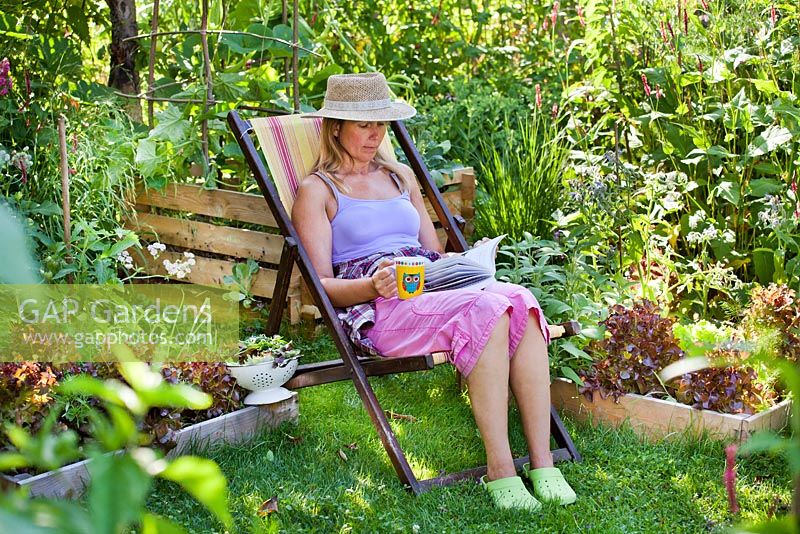 Woman relaxing in the garden.