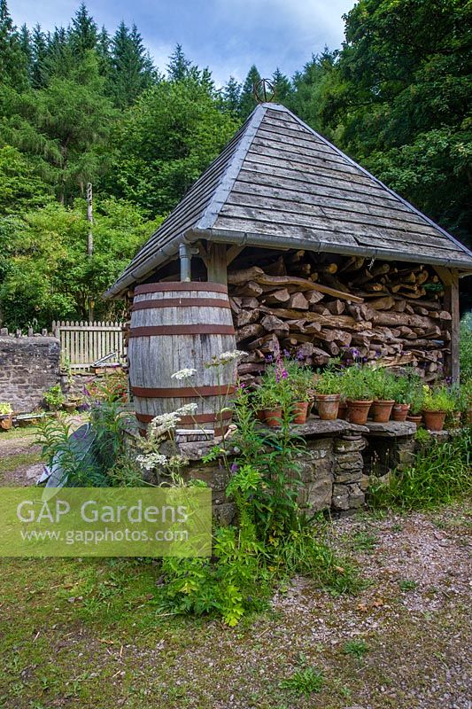 The woodstore, old tin tubs and barrel water butt, Nant Y Bedd, Abergavenny, South Wales