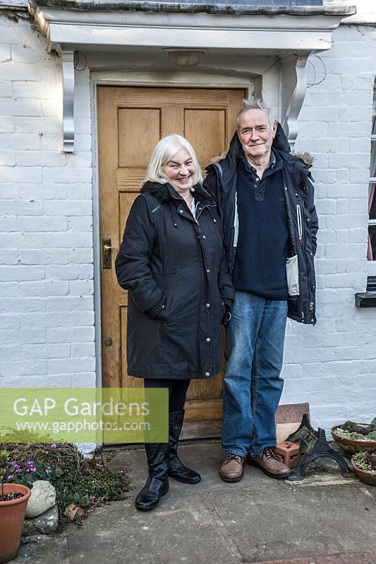 Dr John and Margaret Noakes outside their home, Old Church Cottage.
