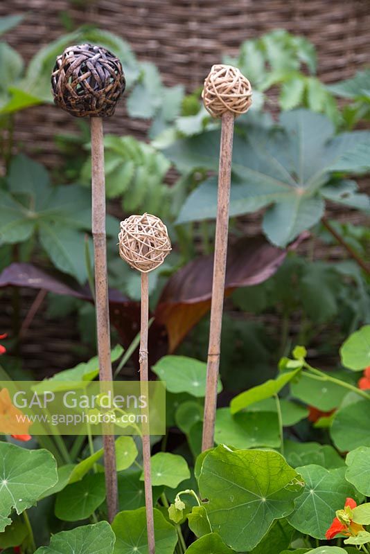 Woven balls used as cane toppers