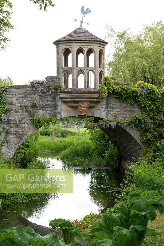 The stone bridge and Watch Tower that spans the water garden at Dunsborough Park.