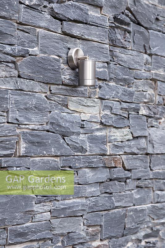 Lighting feature on a dry stone slate wall