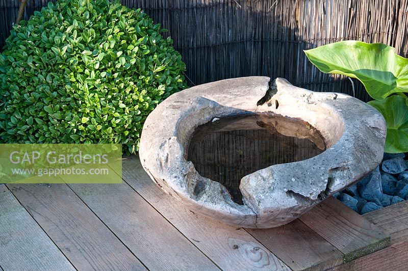Irregular stone circular bird bath feature 