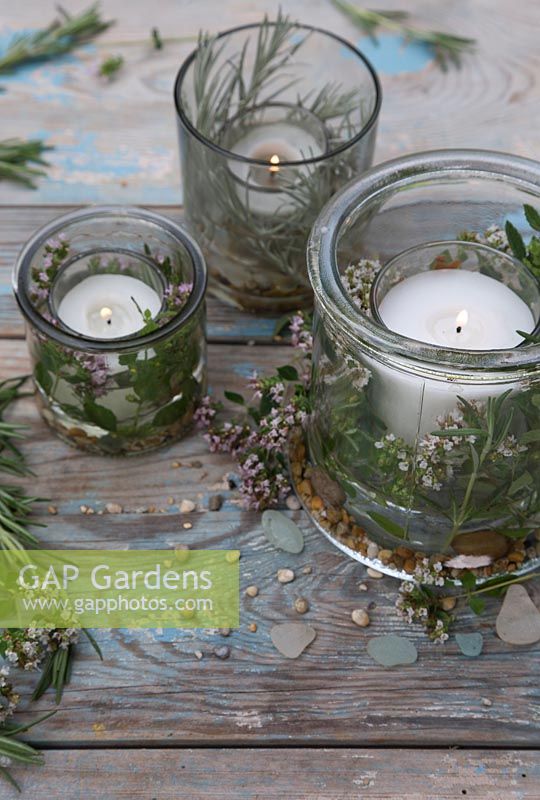 Candles decorated with Curry Plant, Rosemary, Marjoram and Mint