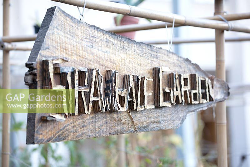 Signboard with wooden letters Strawbale Garden.