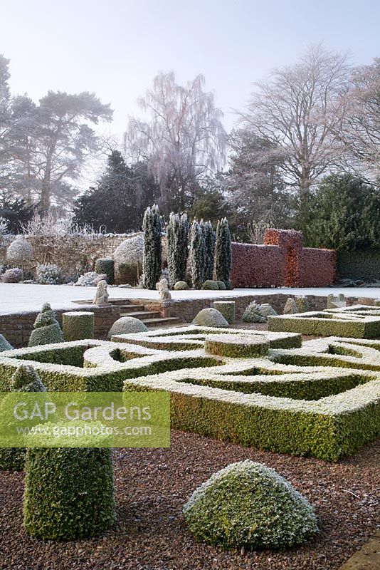 View from box parterre across lawn to frosted border 
