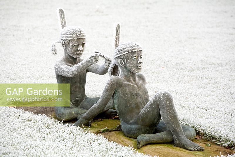 Bronze sculpture of children playing at native American squaws