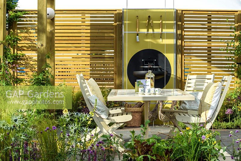 Seating Area. The Green Connection Garden by Jacksons Fencing, BBC Gardeners World Live 2016, Designers: Wardrop 