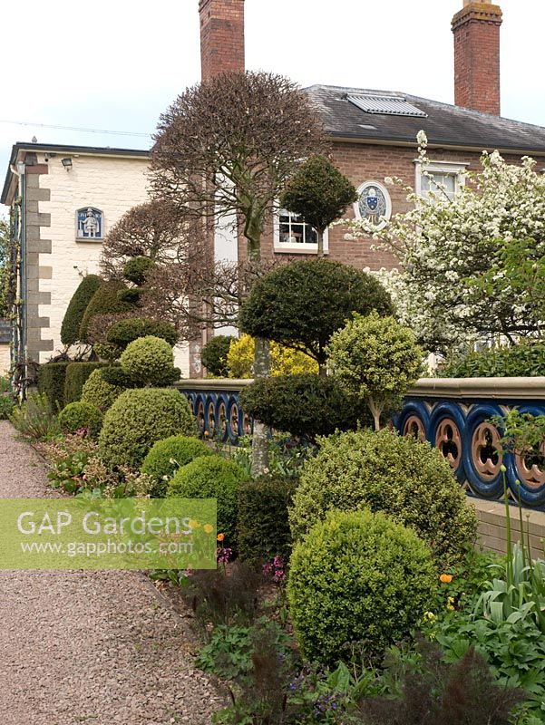 The Laskett Gardens- The drive leading to the house with a variety of topiary in various shapes and sizes.
