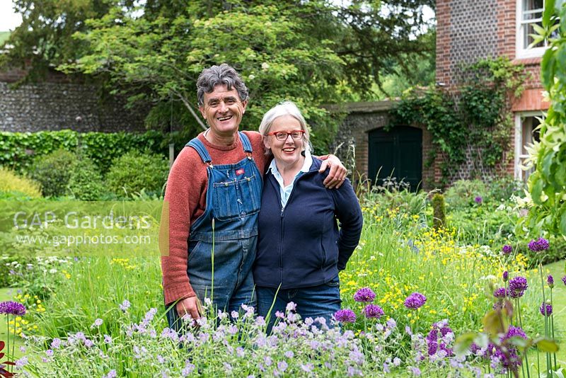 Jim Buckland and Sarah Wain in their fifth-of-an-acre garden in late spring.