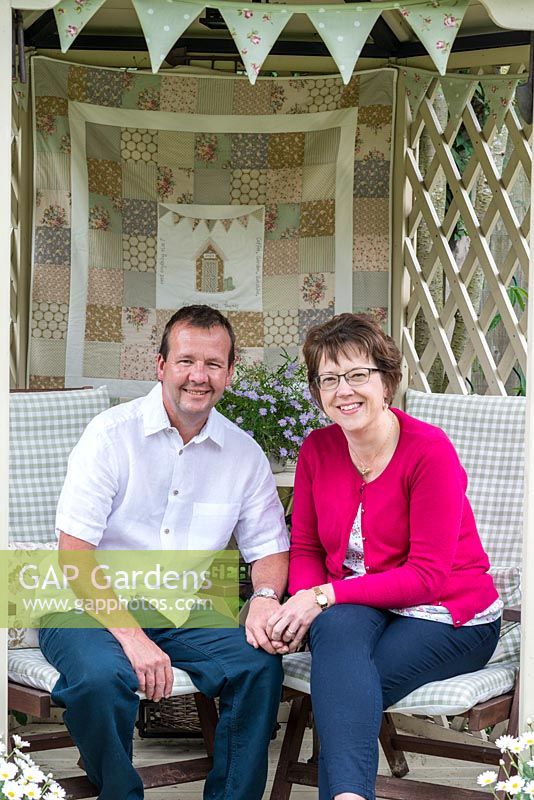 John and Elaine in their gazebo, a lovely spot for viewing their 24m x 7.6m rear town garden.