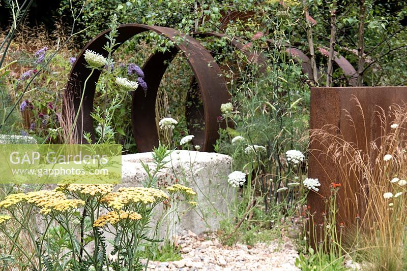 Achillea 'Moonshine', Wild Carrot - Dauca carota and Buddleha davidii reclaim an abandoned urban site. Designed by: Martyn Wilson, Sponsored by St Modwen Properties PLC.