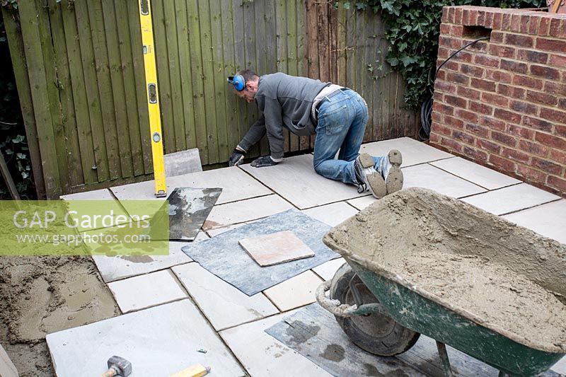 Laying stone paving on patio area