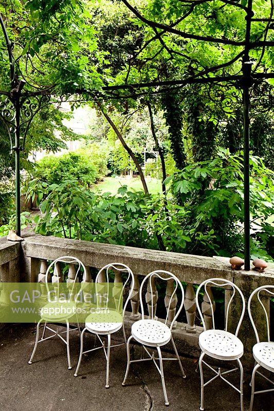 Row of chairs. Villa Singer Garden. Milan. Italy

