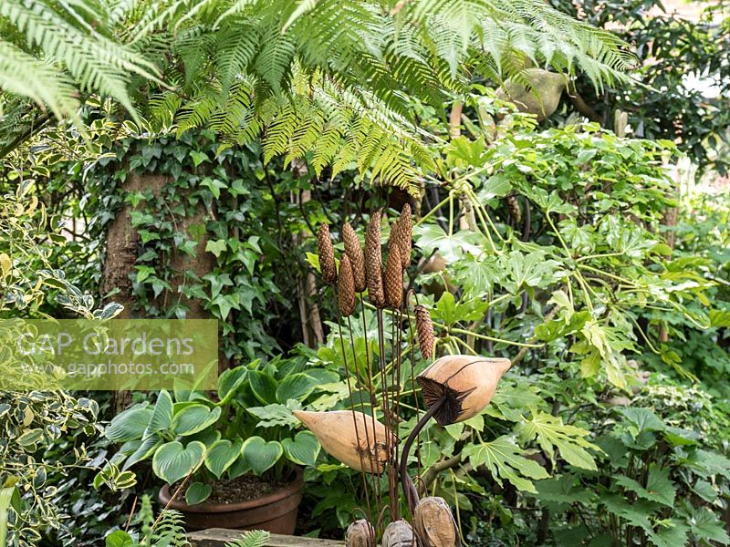 Wooden artefacts adds interest to the green foliage