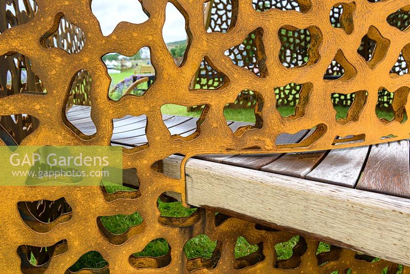 Oak bench and corten steel screen  detail - Curves and Cube - RHS Chatsworth Flower Show 2017 - Designer, Builder, Sponsor: Gaze Burvill and David Harber