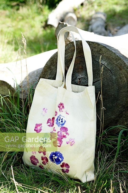 Printing onto fabric bag with fresh flowers. Finished printed bag