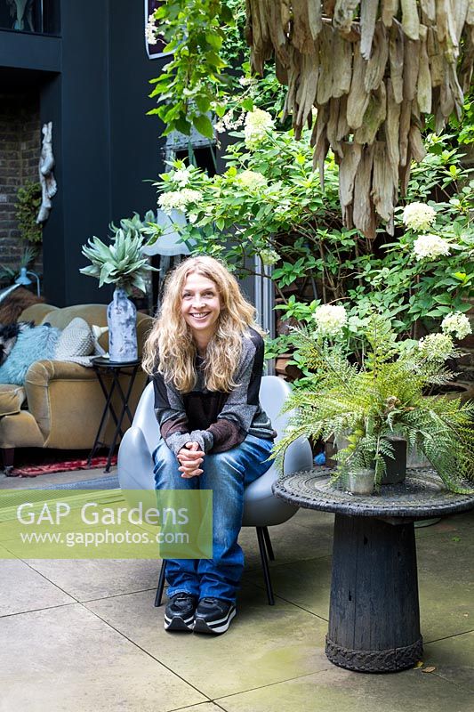 Abigail Ahern, designer in her garden. Hackney, London