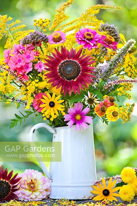 Jug of late summer flowers including Sunflowers