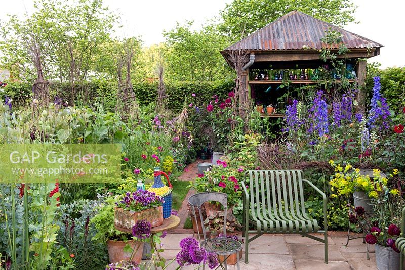 The Anneka Rice Colour Cutting Garden - Cut flower garden with seating area. shed with galvanised roof -  RHS Chelsea Flower Show 2017
