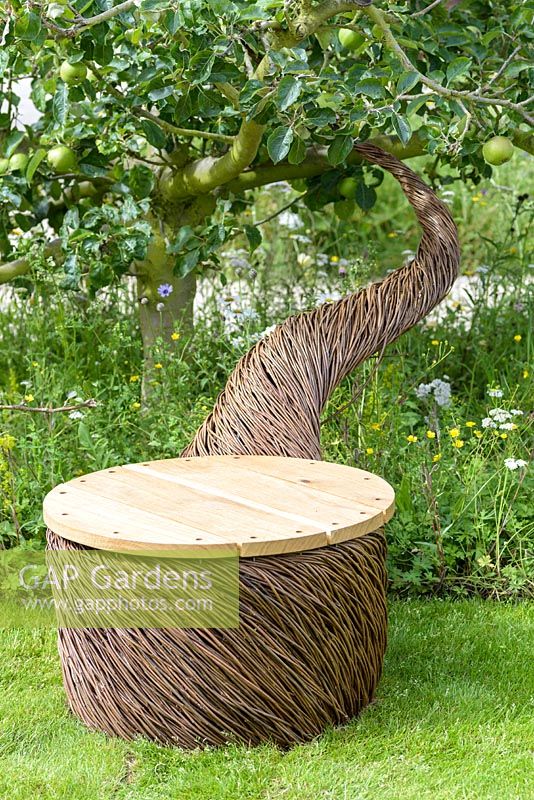A willow chair  sculpture by Tom Hare -  It's All About Community Garden - RHS Hampton Court Palace Flower Show 2017 -Designers: Andrew Fisher Tomlin and Dan Bowyer.