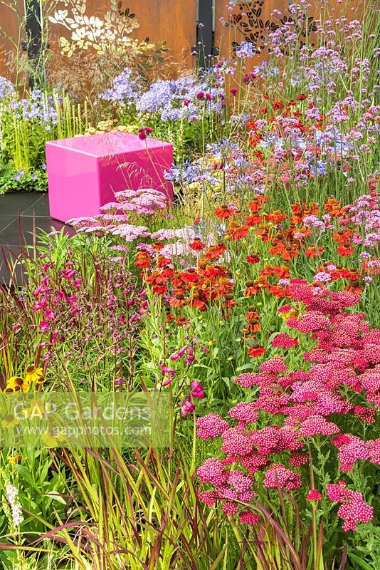 The Colour Box garden at the RHS Hampton Court Flower Show 2017. Designers: Charlie Bloom and Simon Webster. Sponsors: Stark and Greensmith, London Ston