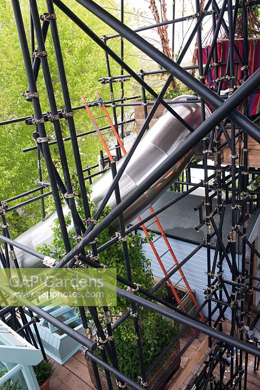 Looking through scaffolding The Westland Magical Garden by Diarmuid Gavin at RHS Chelsea Flower Show 2012