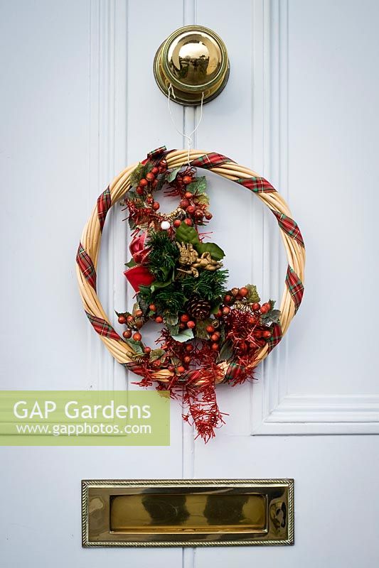 Christmas wreath on front door of house